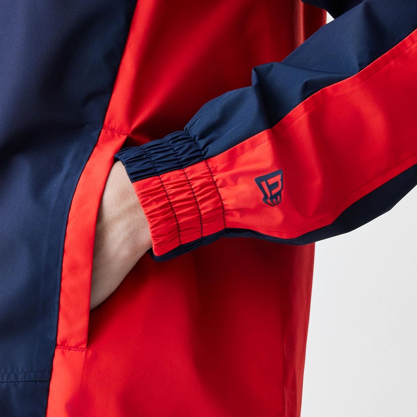 The Male model is wearing Red Bull Racing Dark Blue Windrunner Jacket 4