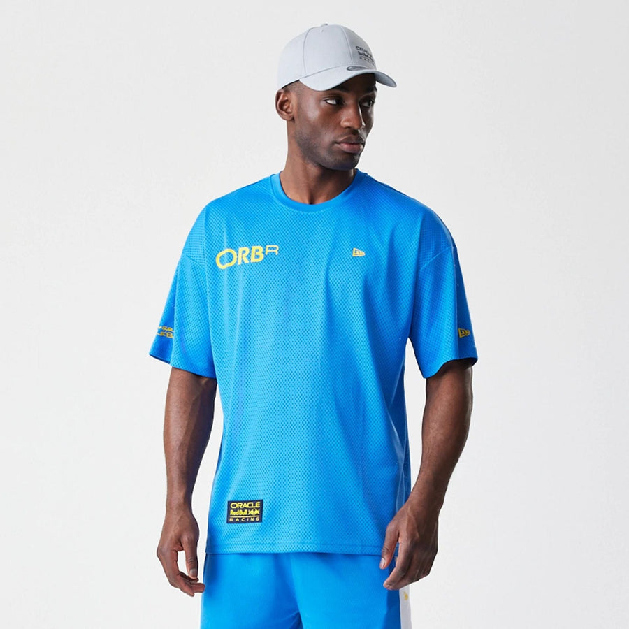 The Male model is wearing Red Bull Racing Graphic Mesh Blue Oversized T-Shirt 6
