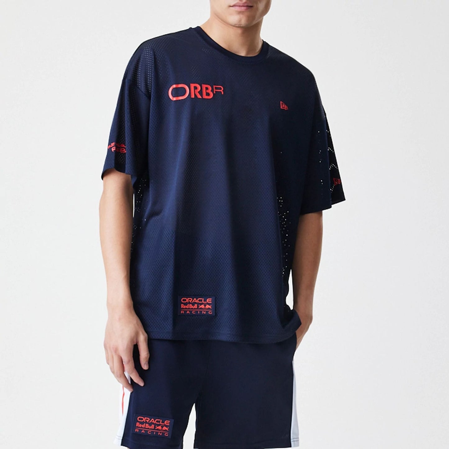 The Male model is wearing Red Bull Racing Graphic Mesh Dark Blue Oversized T-Shirt 7