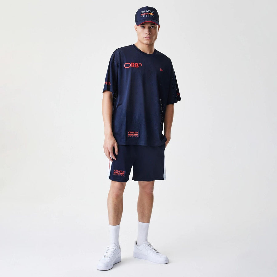 The Male model is wearing Red Bull Racing Graphic Mesh Dark Blue Oversized T-Shirt 8