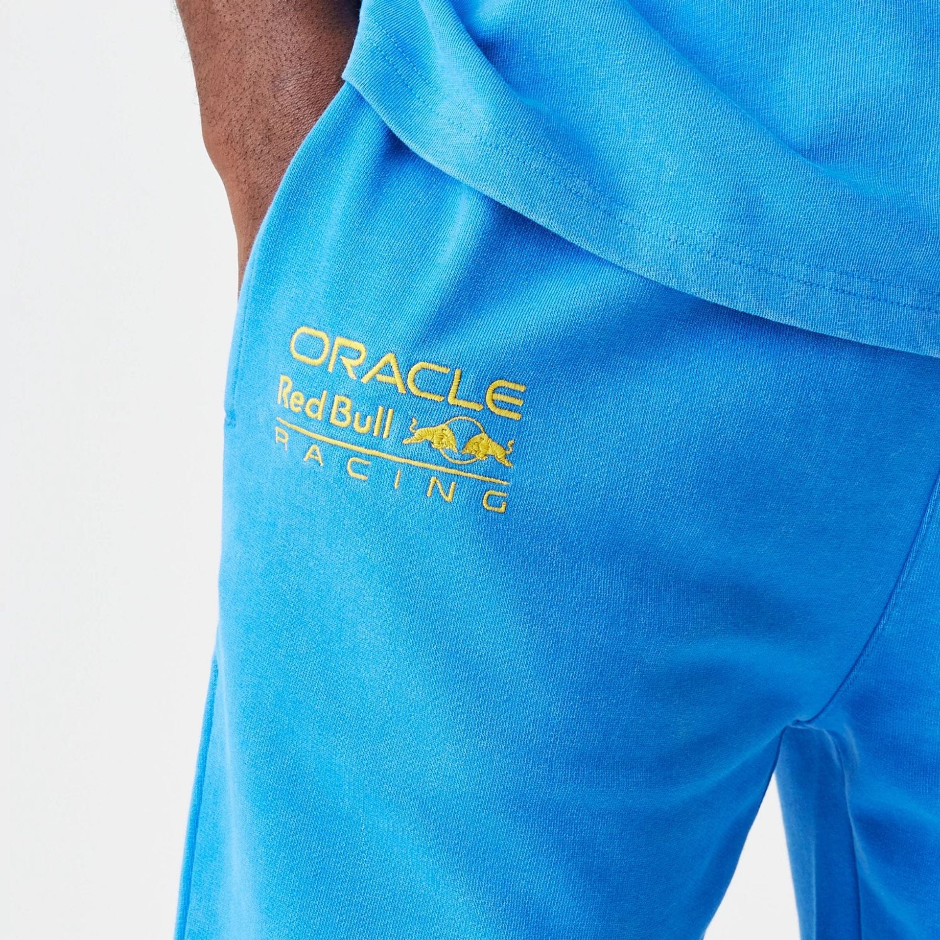 The Male model is wearing Red Bull Racing Blue Joggers 3