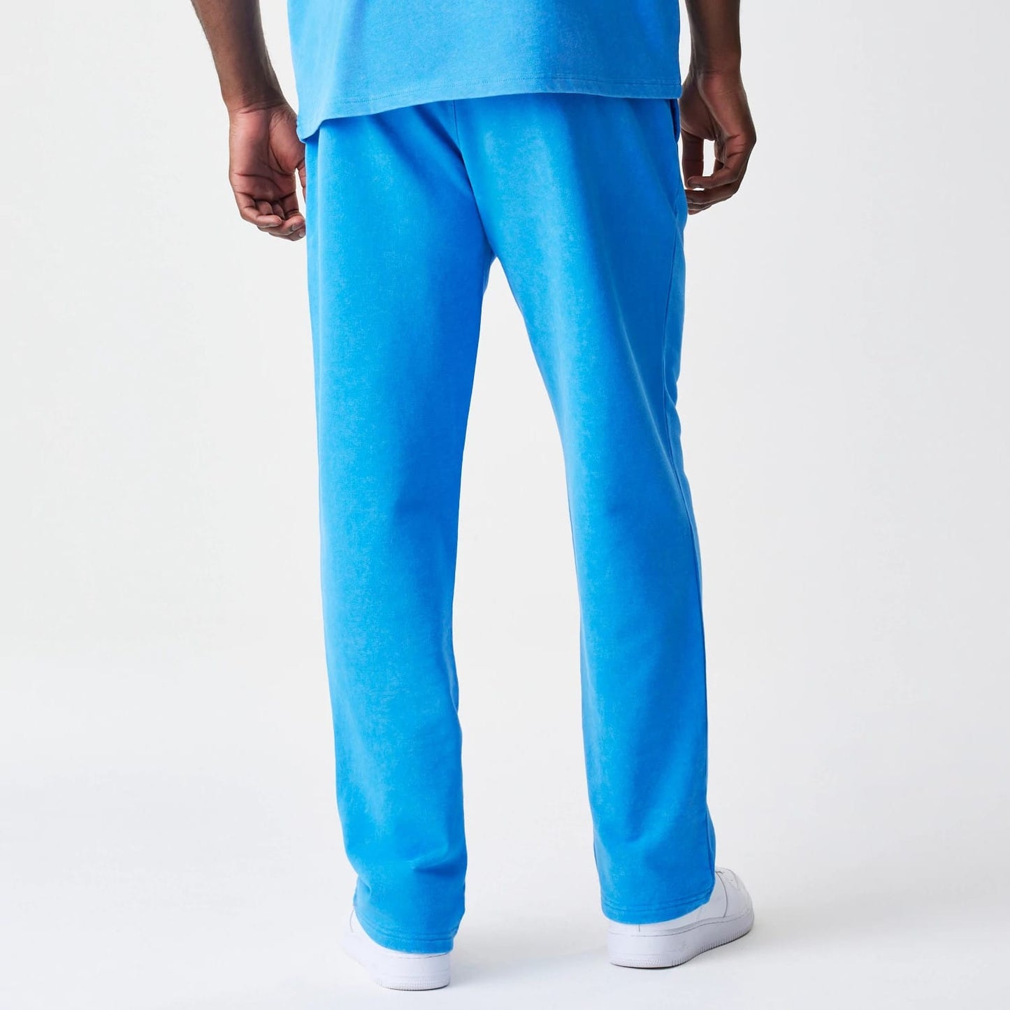 The Male model is wearing Red Bull Racing Blue Joggers 2