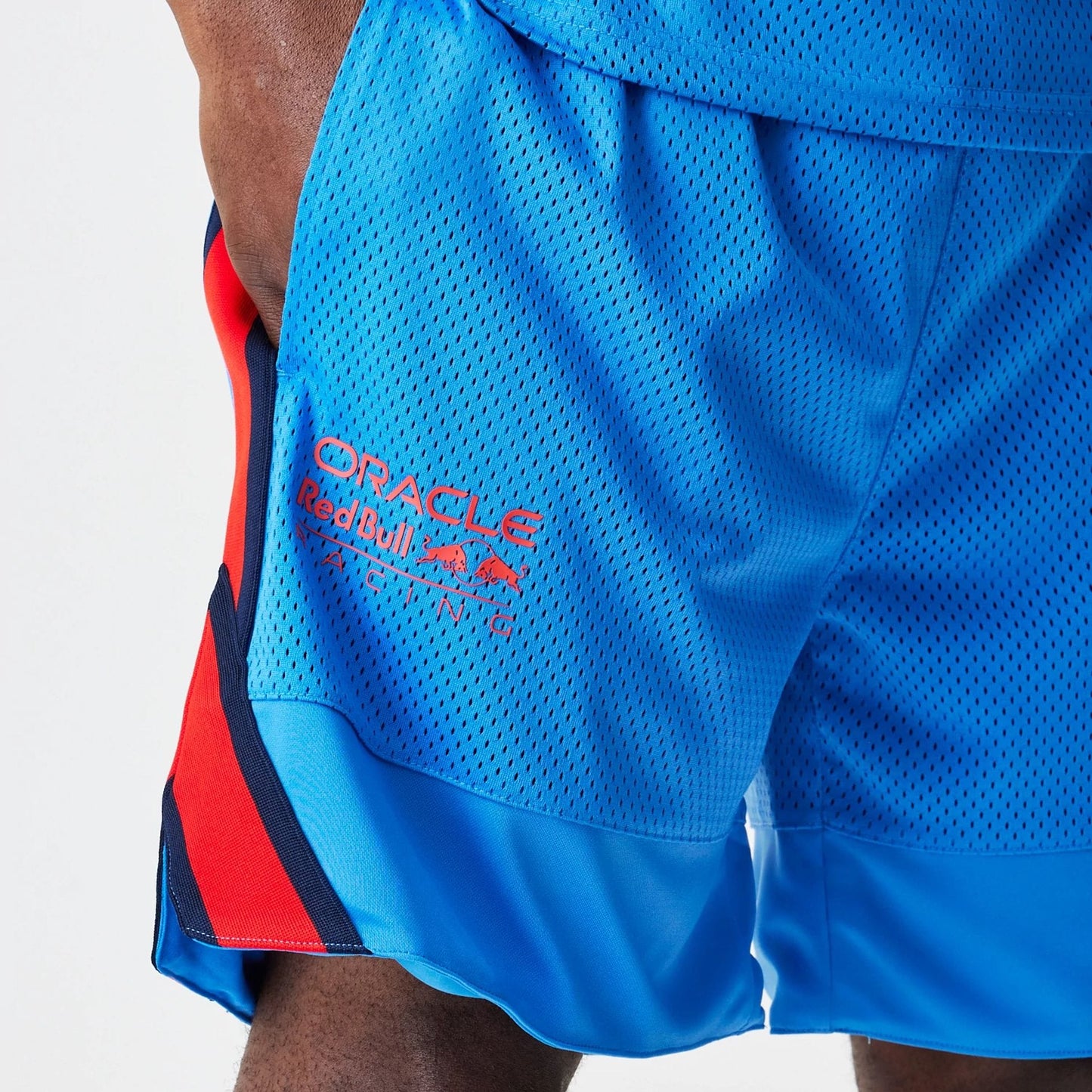 The Male model is wearing Red Bull Racing Basketball Mesh Blue Shorts 3