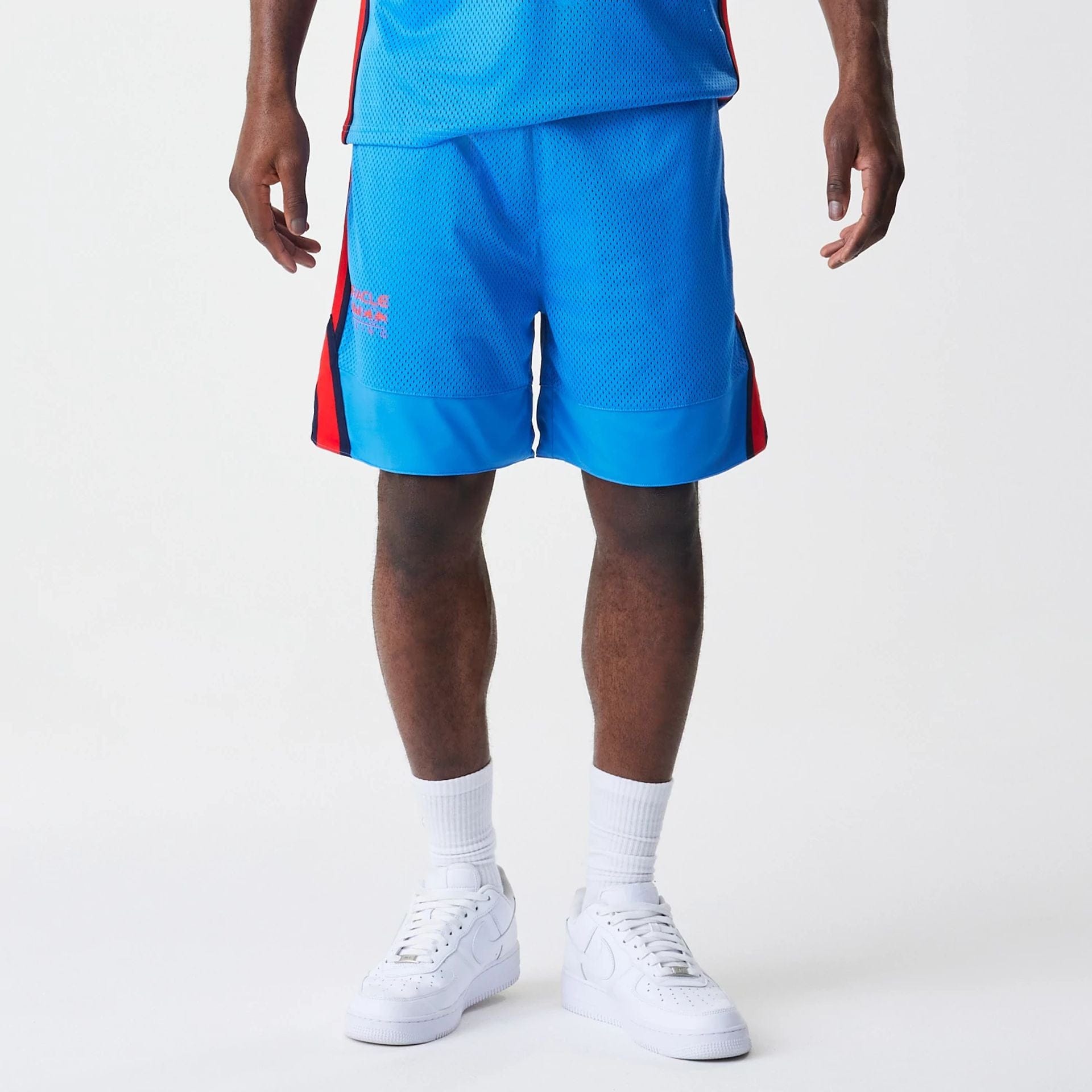 The Male model is wearing Red Bull Racing Basketball Mesh Blue Shorts 7