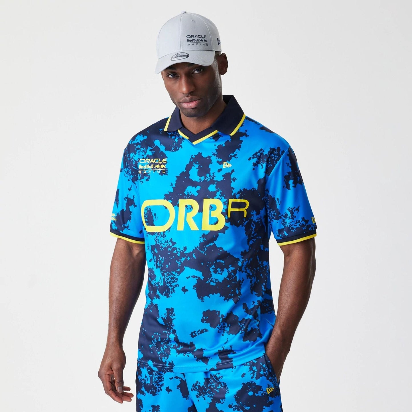 The Male model is wearing Red Bull Racing Graphic Blue Football Jersey 1