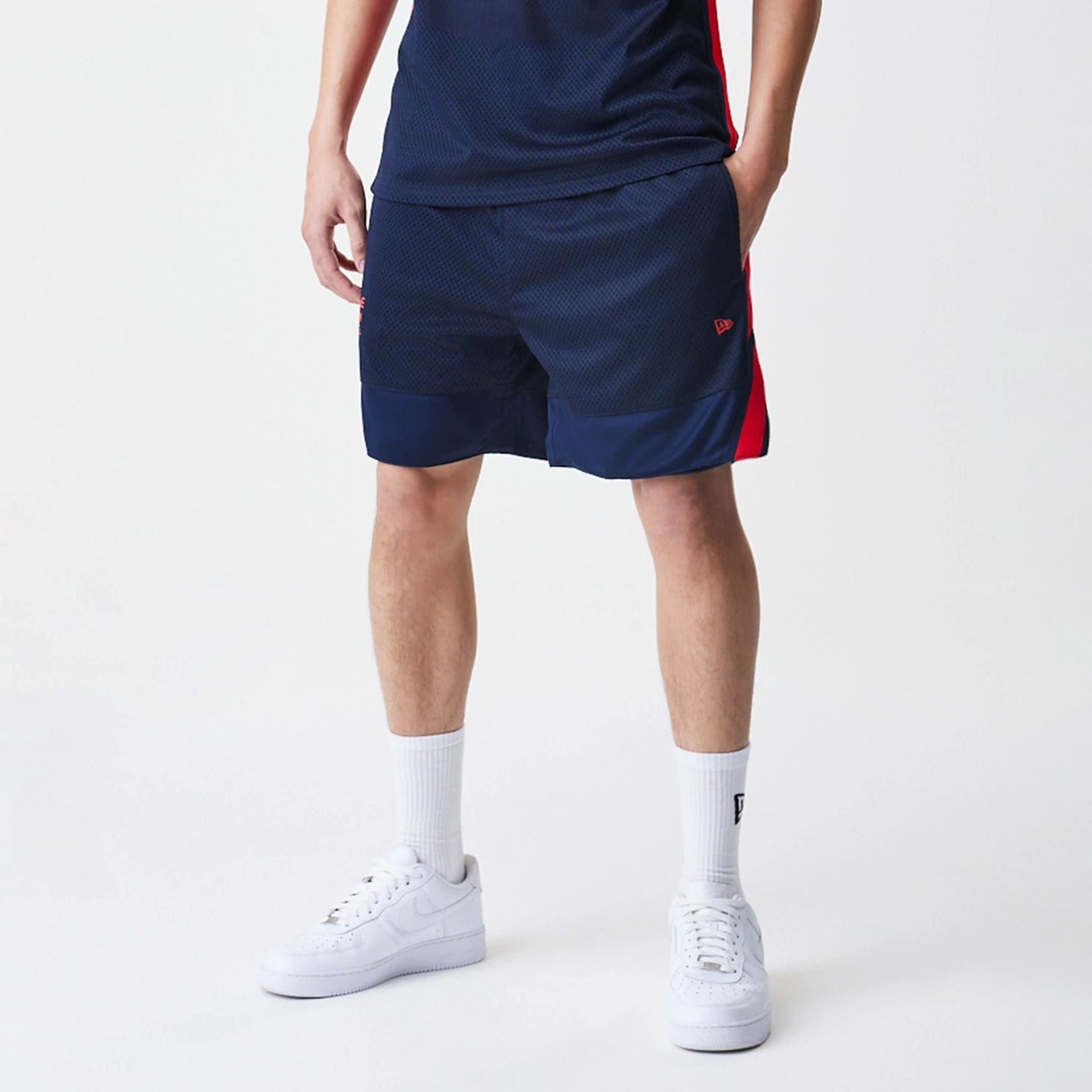The Male model is wearing Red Bull Racing Basketball Mesh Dark Blue Shorts 5
