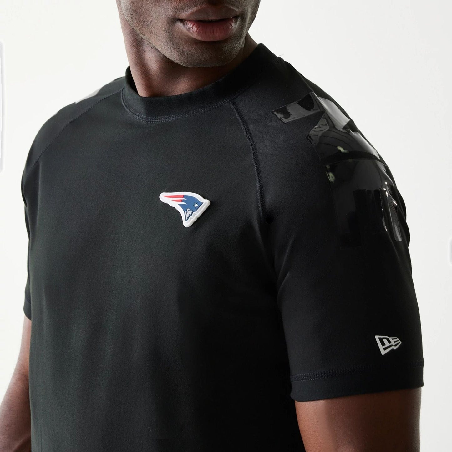 The Male model is wearing New England Patriots NFL 3RD Down Black T-Shirt 3