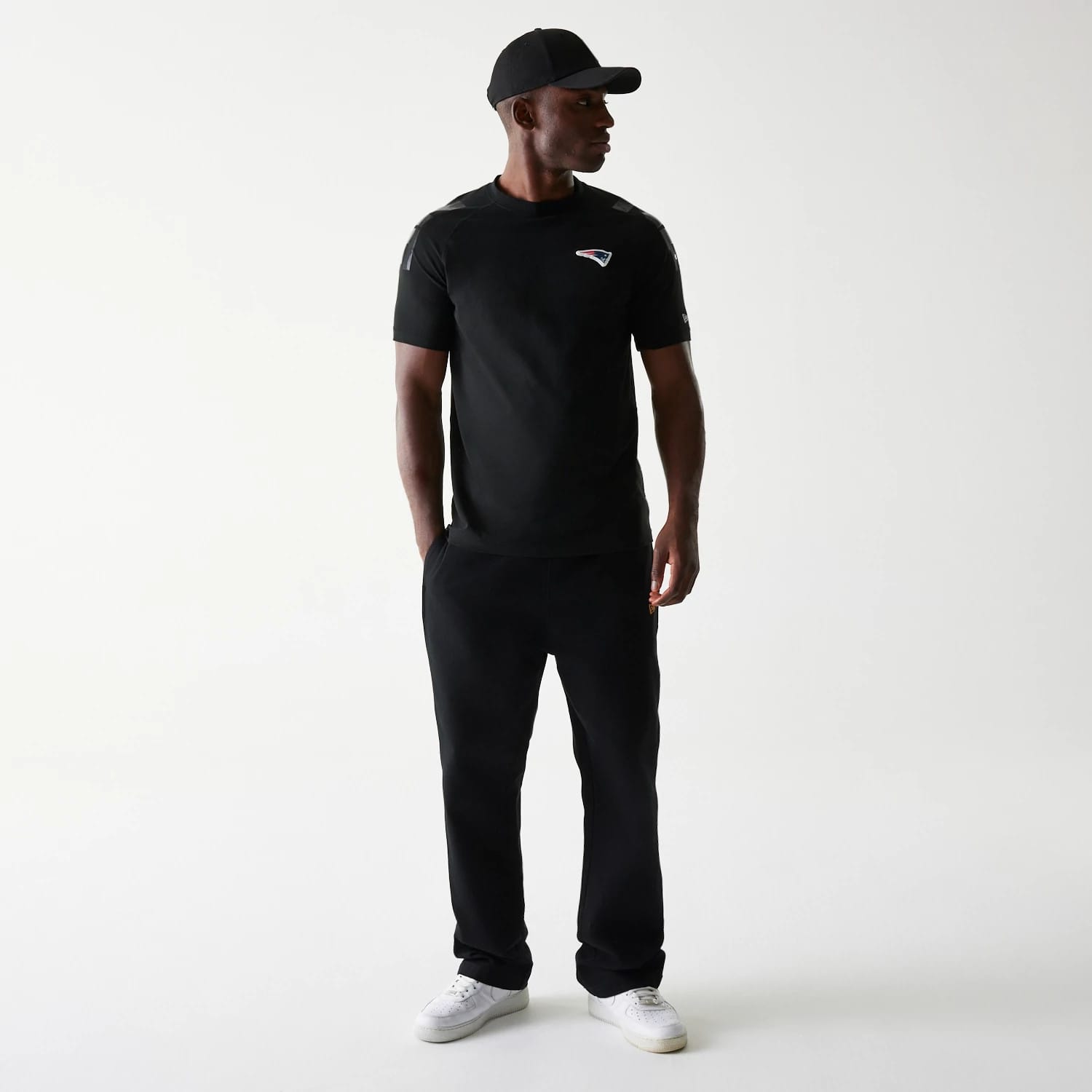 The Male model is wearing New England Patriots NFL 3RD Down Black T-Shirt 8