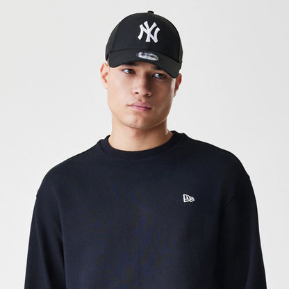 The Male model is wearing New Era Premium Essential Black Oversized Crew Neck Sweater 6