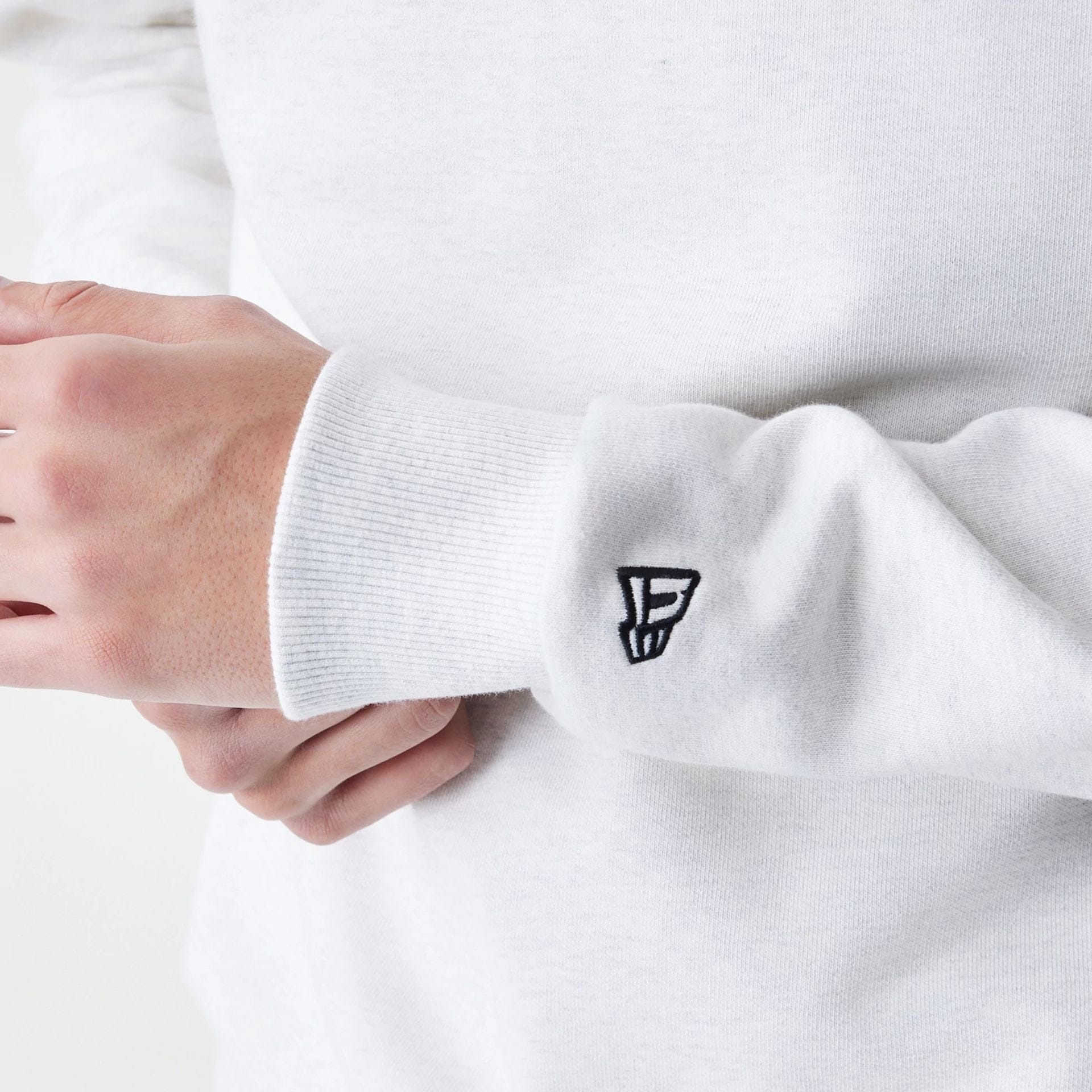 The Male model is wearing New Era Premium Essential Pastel Grey Oversized Crew Neck Sweater 5