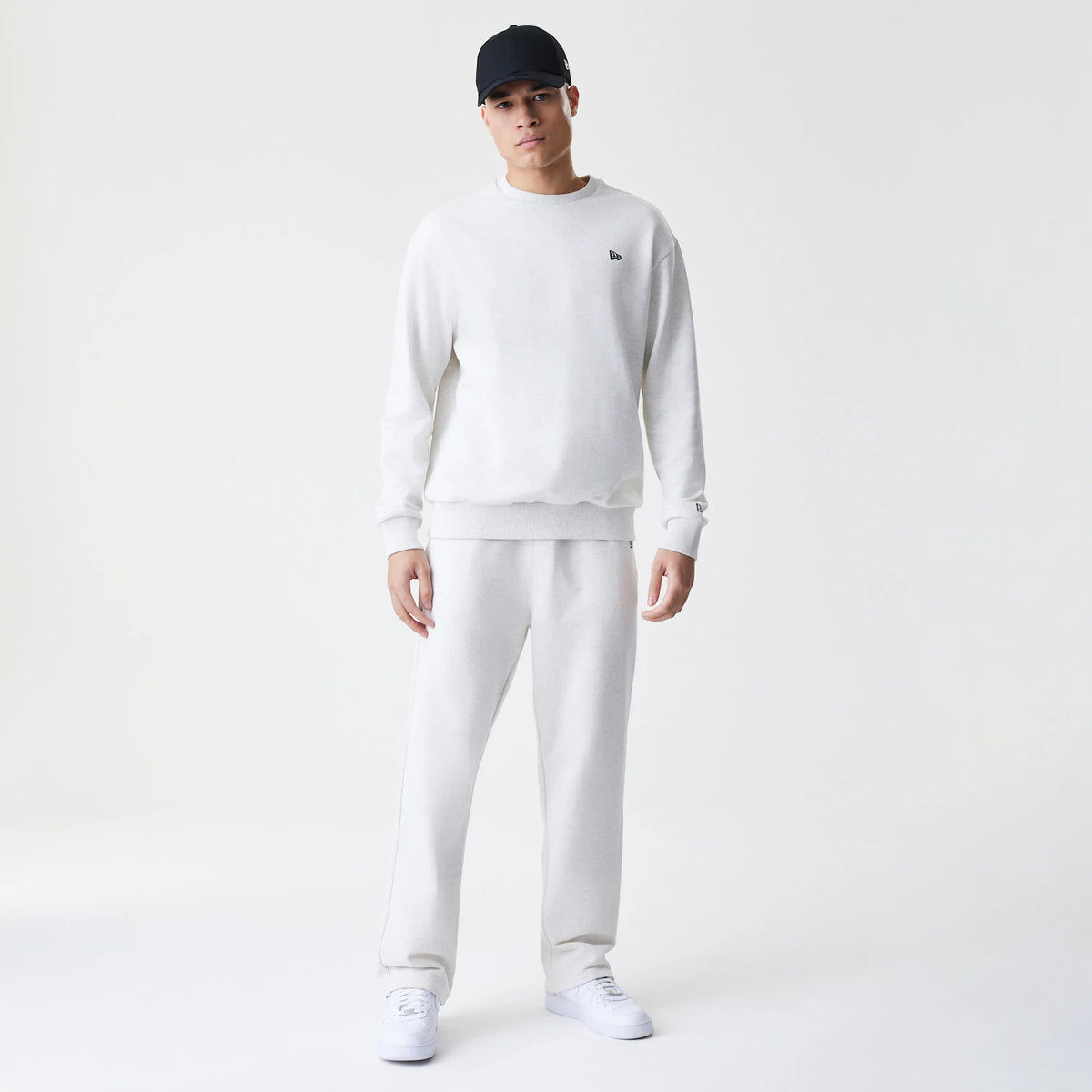 The Male model is wearing New Era Premium Essential Pastel Grey Oversized Crew Neck Sweater 8