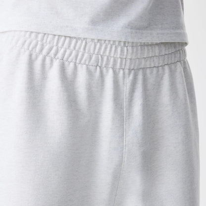 The Male model is wearing New Era Premium Essential Pastel Grey Joggers 6
