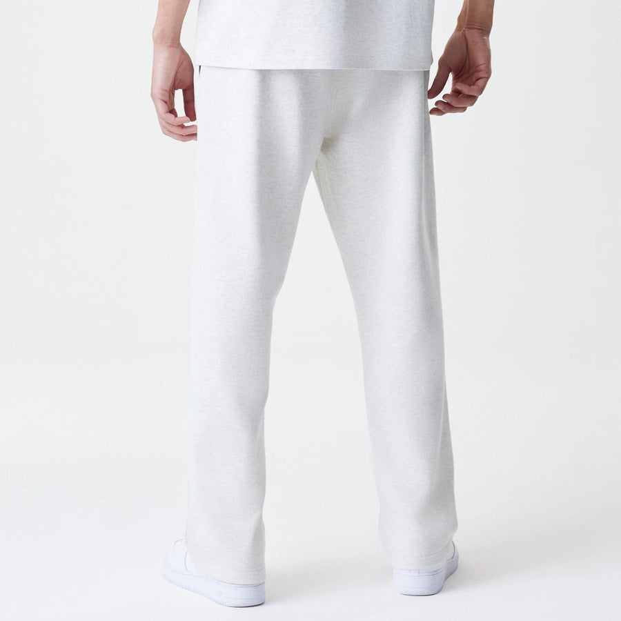 The Male model is wearing New Era Premium Essential Pastel Grey Joggers 2