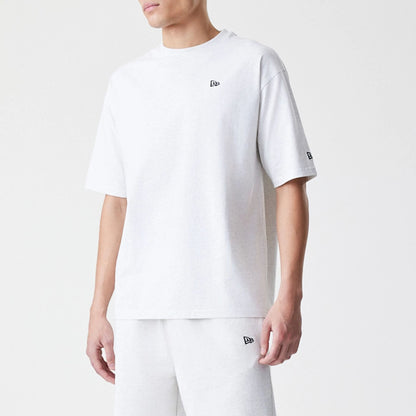 The Male model is wearing New Era Premium Essential Pastel Grey Oversized T-Shirt 3