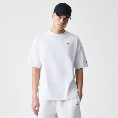The Male model is wearing New Era Premium Essential Pastel Grey Oversized T-Shirt 1