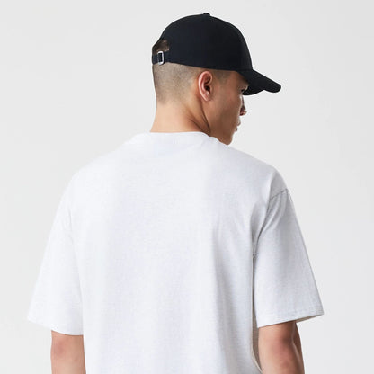 The Male model is wearing New Era Premium Essential Pastel Grey Oversized T-Shirt 7