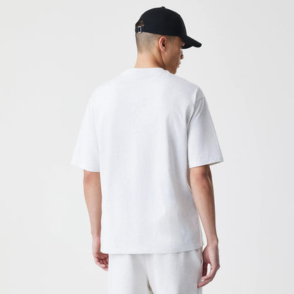 The Male model is wearing New Era Premium Essential Pastel Grey Oversized T-Shirt 2