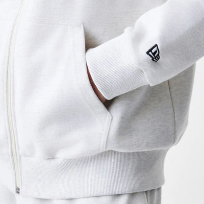 The Male model is wearing New Era Premium Essential Pastel Grey Oversized Full Zip Hoodie 5