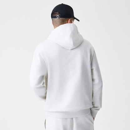 The Male model is wearing New Era Premium Essential Pastel Grey Oversized Full Zip Hoodie 2