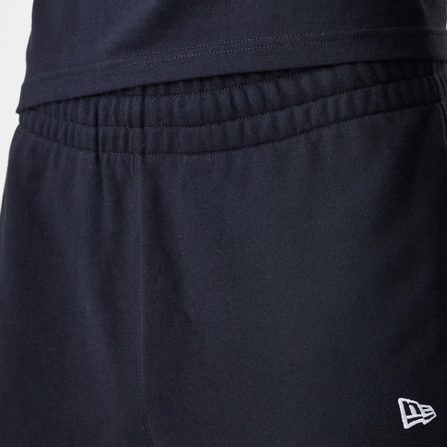 The Male model is wearing New Era Premium Essential Black Joggers 6