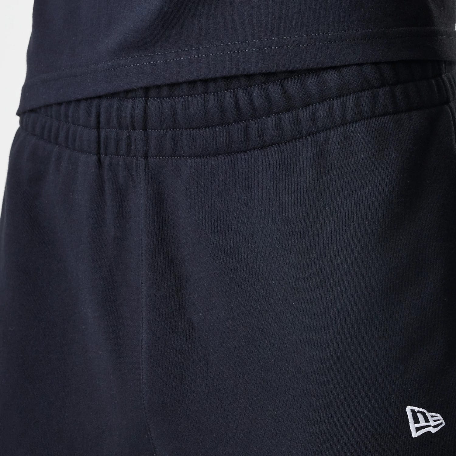 The Male model is wearing New Era Premium Essential Black Joggers 6