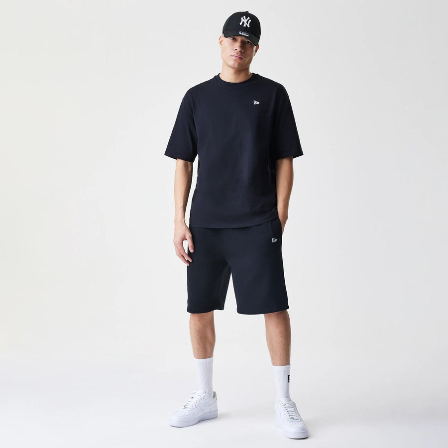 The Male model is wearing New Era Premium Essential Black Oversized T-Shirt 8