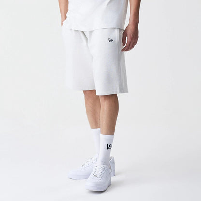The Male model is wearing New Era Premium Essential Pastel Grey Oversized Shorts 3