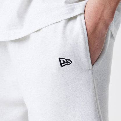 The Male model is wearing New Era Premium Essential Pastel Grey Oversized Shorts 5