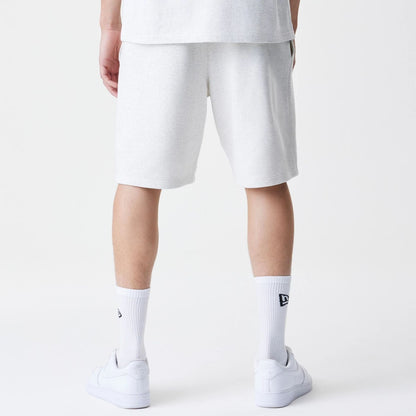 The Male model is wearing New Era Premium Essential Pastel Grey Oversized Shorts 2