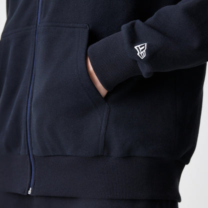 The Male model is wearing New Era Premium Essential Black Oversized Full Zip Hoodie 5