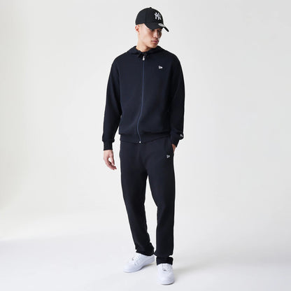 The Male model is wearing New Era Premium Essential Black Oversized Full Zip Hoodie 8