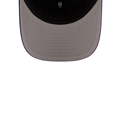 LA Lakers NBA Team Purple New Era 9FORTY M-Crown Adjustable Cap, inside view showing the grey undervisor and black sweatband with branded taping, highlighting the curved visor structure.