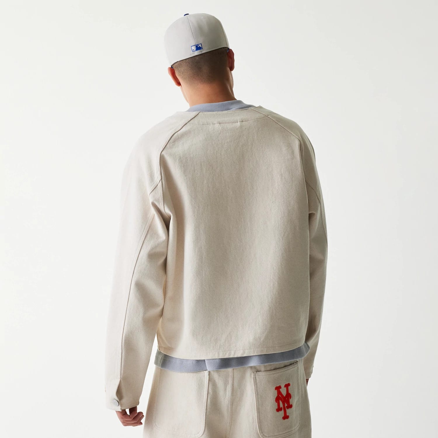 The Male model is wearing New York Mets MLB Cotton Open Cream Jacket 2