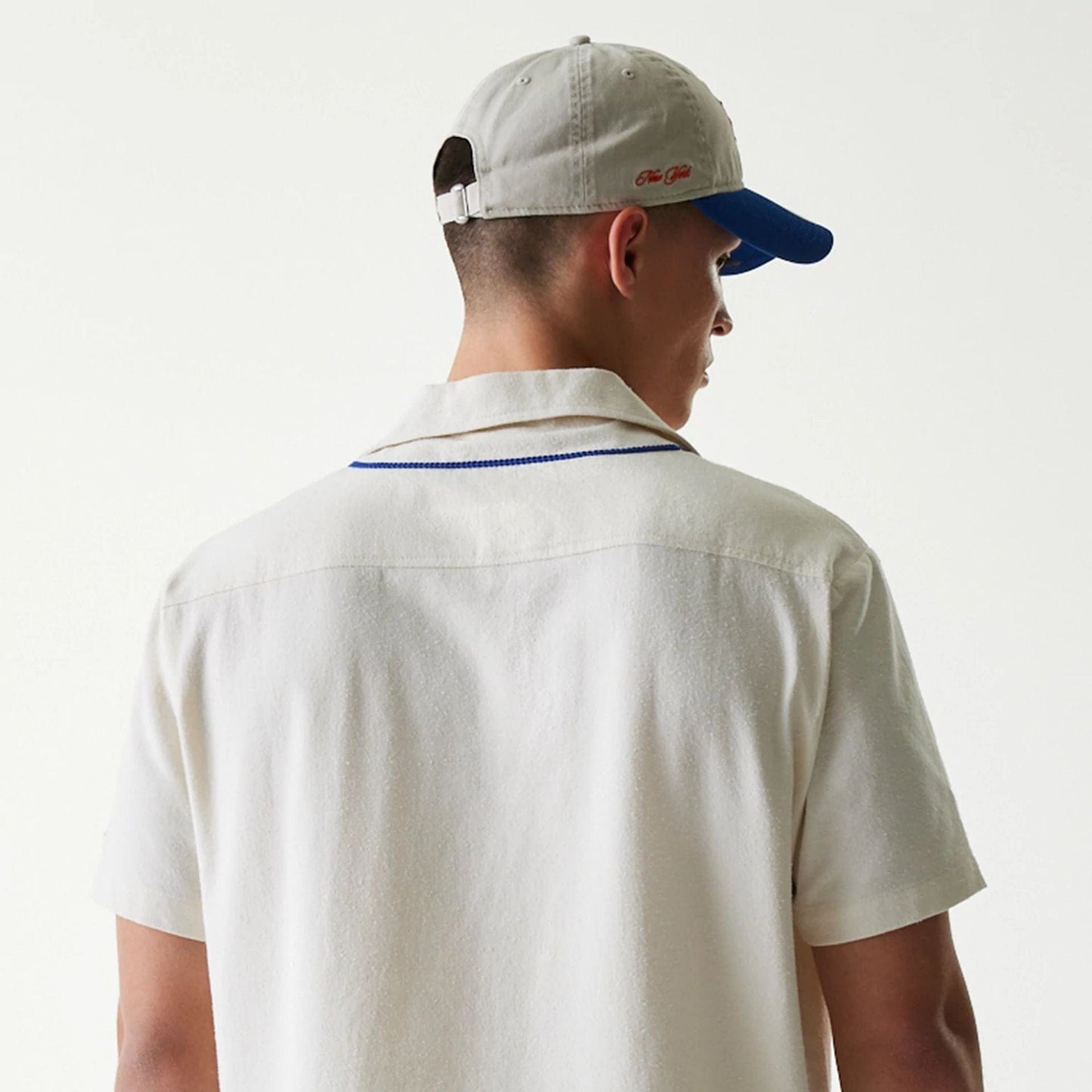 The Male model is wearing New York Mets MLB Piping Open Cream Short Sleeve Shirt 7