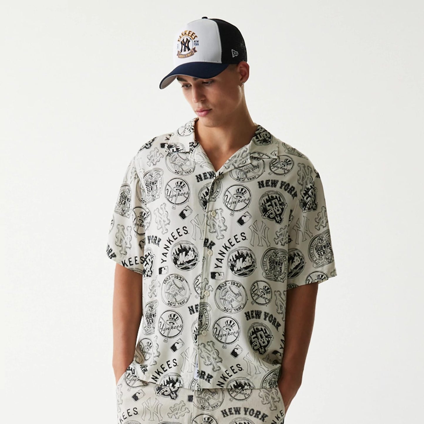 The Male model is wearing MLB Subway Series All Over Print Open White Short Sleeve Shirt 6