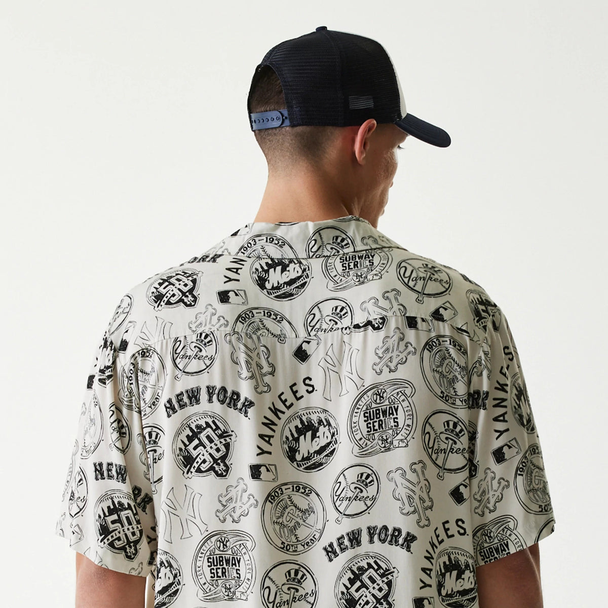 The Male model is wearing MLB Subway Series All Over Print Open White Short Sleeve Shirt 7