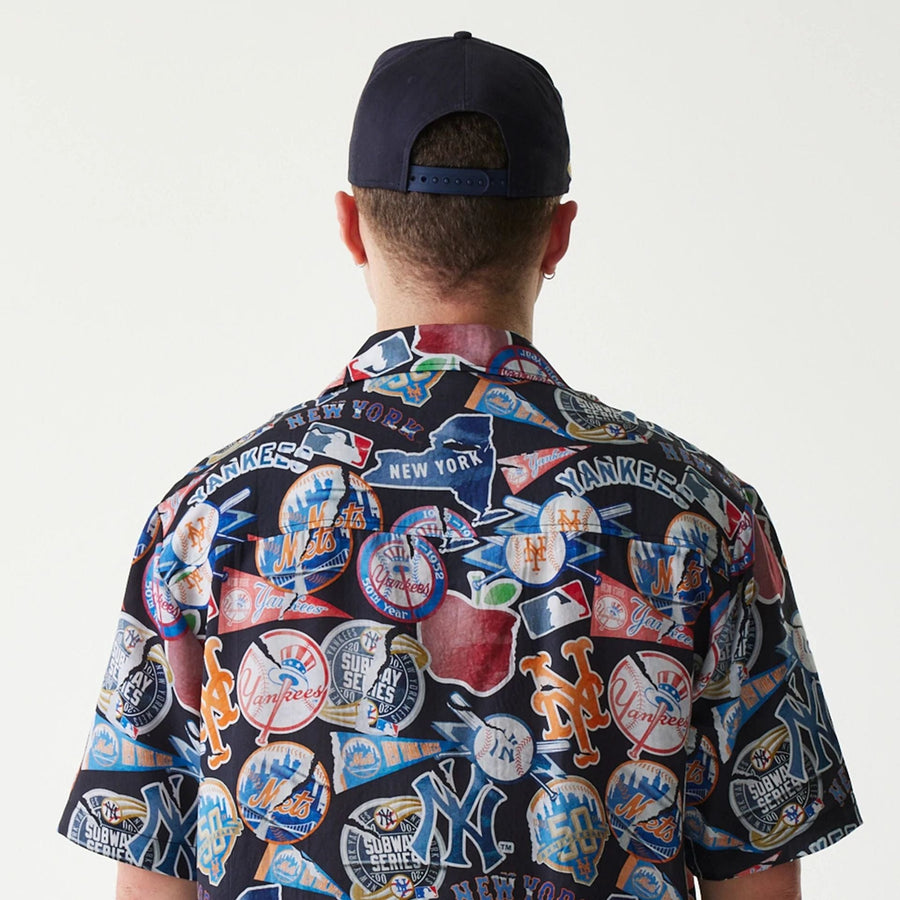 The Male model is wearing MLB Subway Series All Over Print Navy Short Sleeve Shirt 7