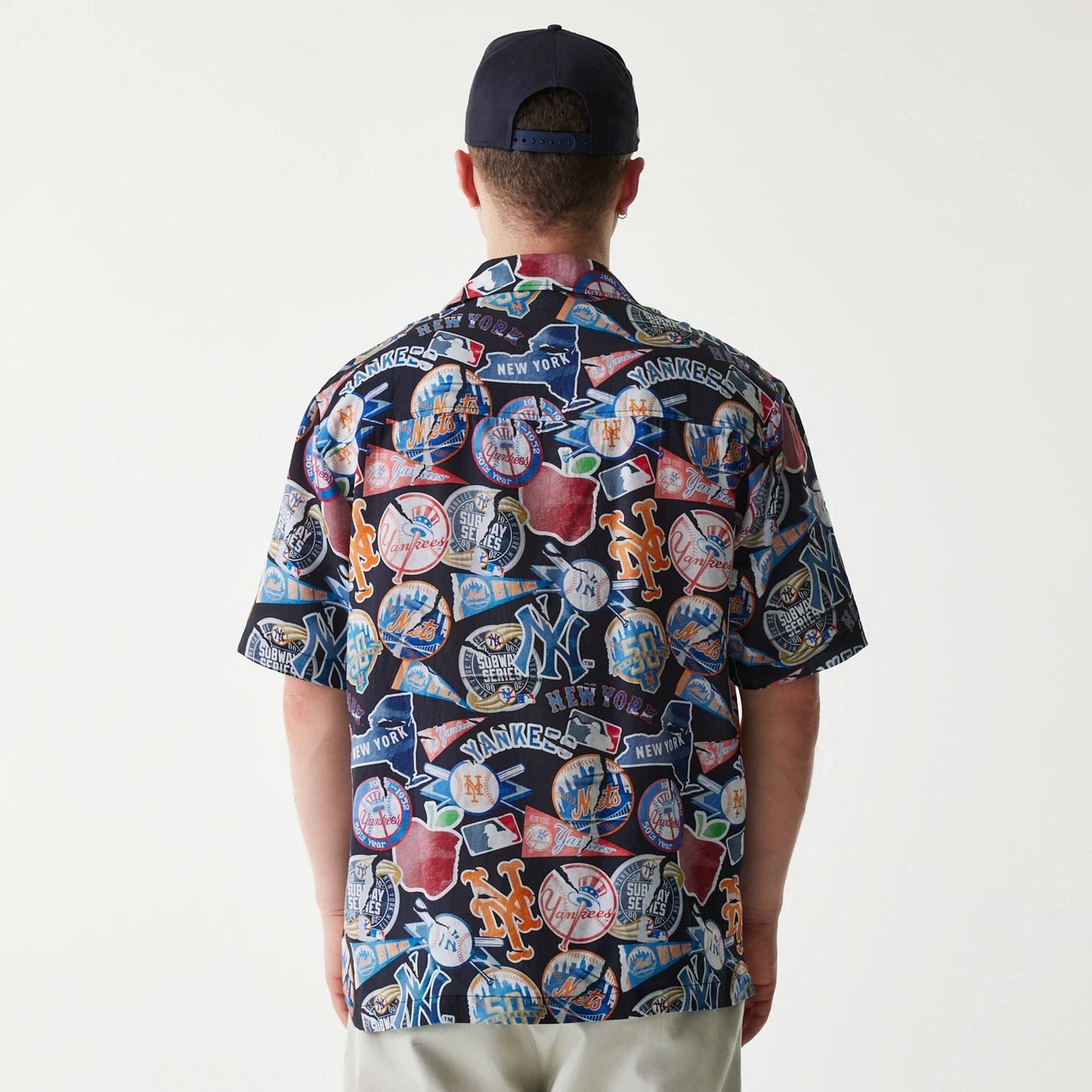 The Male model is wearing MLB Subway Series All Over Print Navy Short Sleeve Shirt 2