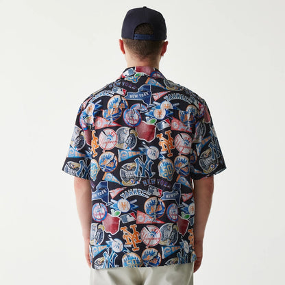 The Male model is wearing MLB Subway Series All Over Print Navy Short Sleeve Shirt 2