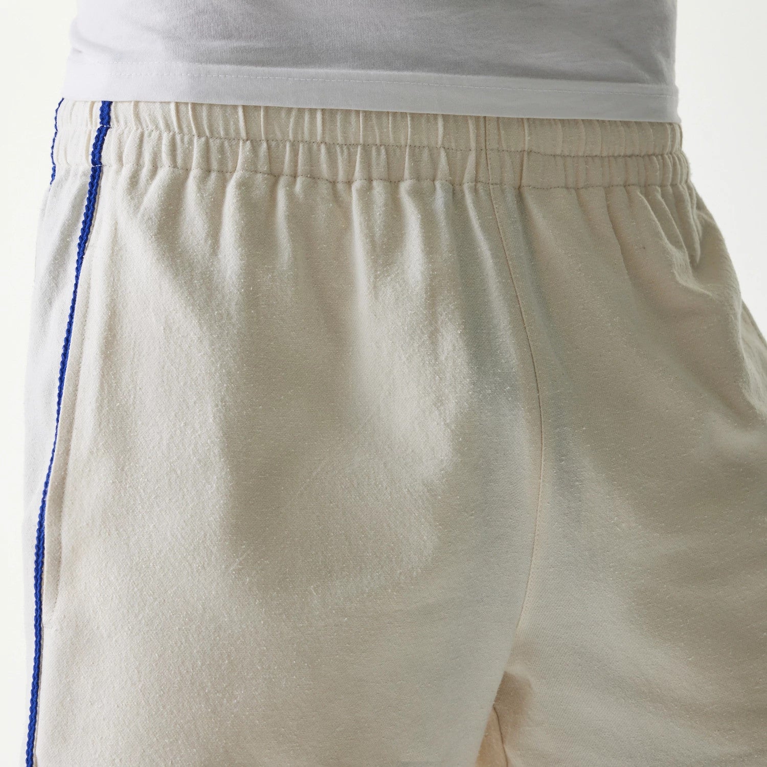 The Male model is wearing New York Mets MLB Piping Open Cream Shorts 6