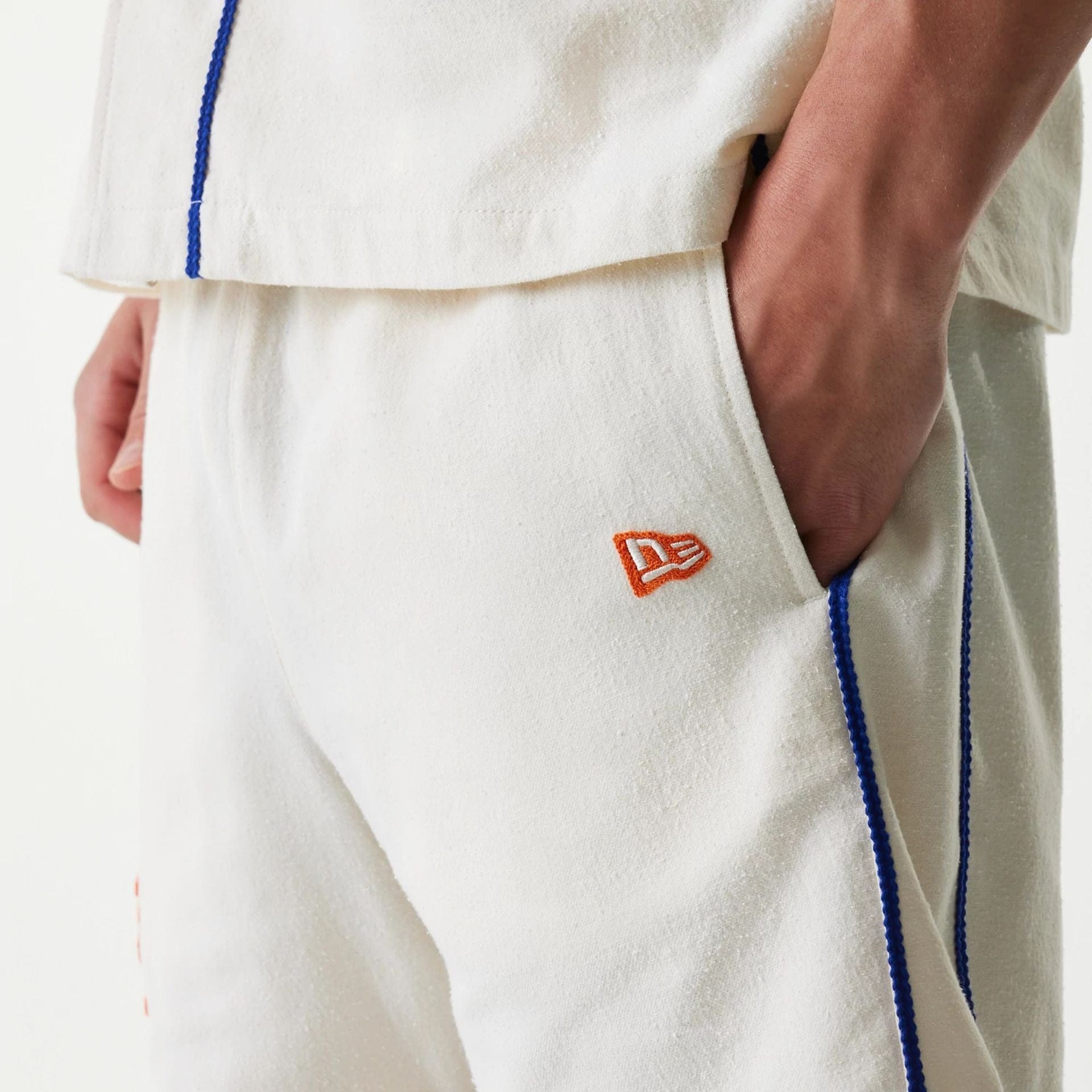 The Male model is wearing New York Mets MLB Piping Open Cream Shorts 5