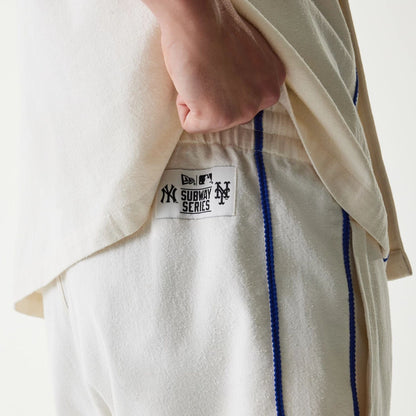 The Male model is wearing New York Mets MLB Piping Open Cream Shorts 4