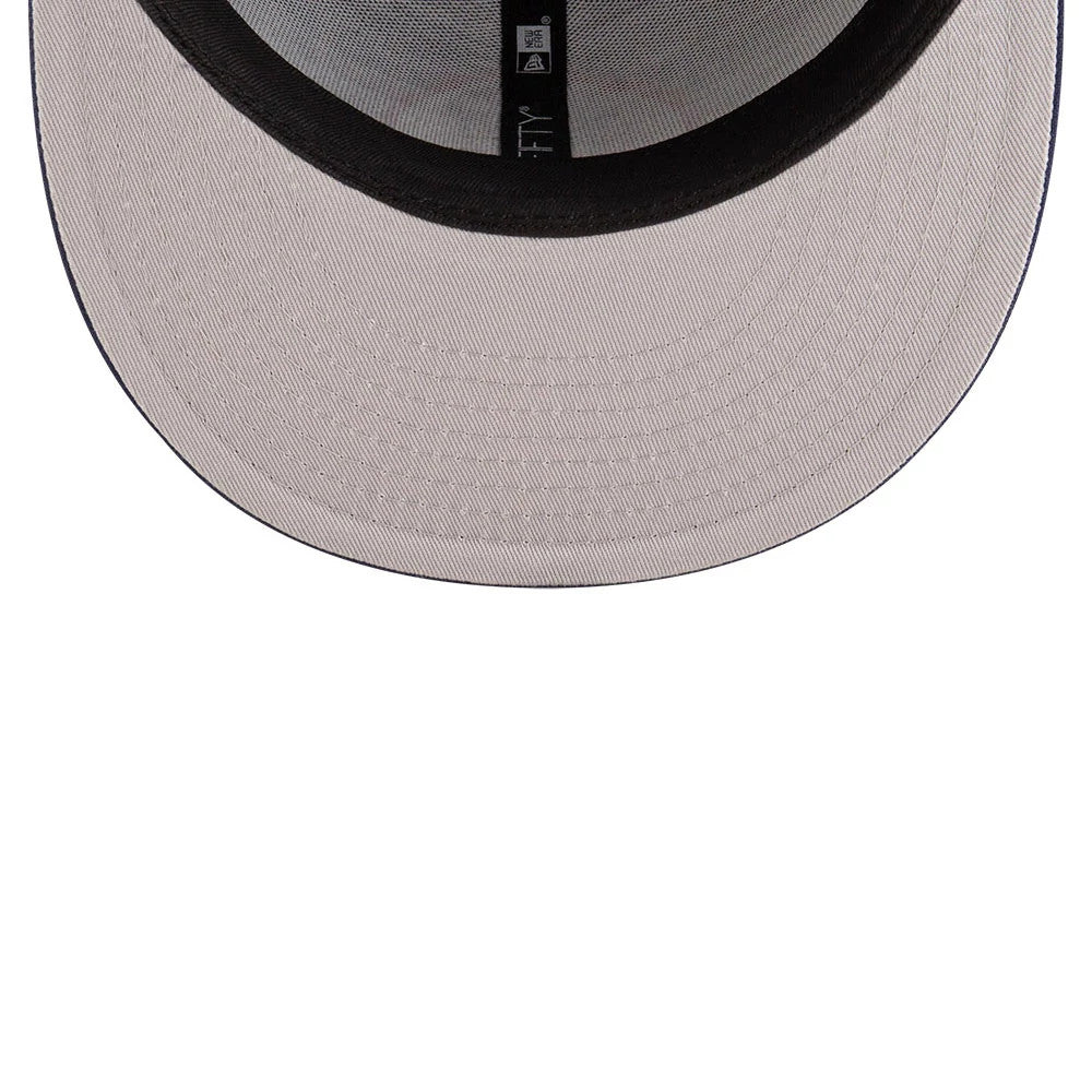 Kansas City Scouts NHL Basic Navy New Era 59FIFTY Fitted Cap, inside view showing a grey undervisor, black sweatband, and New Era taping along the interior seams, enhancing the structured fit of the cap.