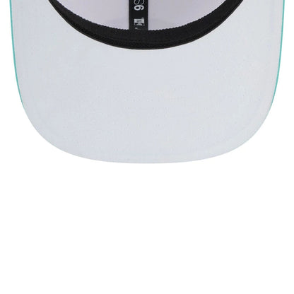 This is a Torque LIV Golf 2025 White 9SEVENTY Stretch Snap Adjustable Cap 2