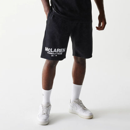 The Male model is wearing McLaren Racing Wordmark Black Oversized Shorts 1