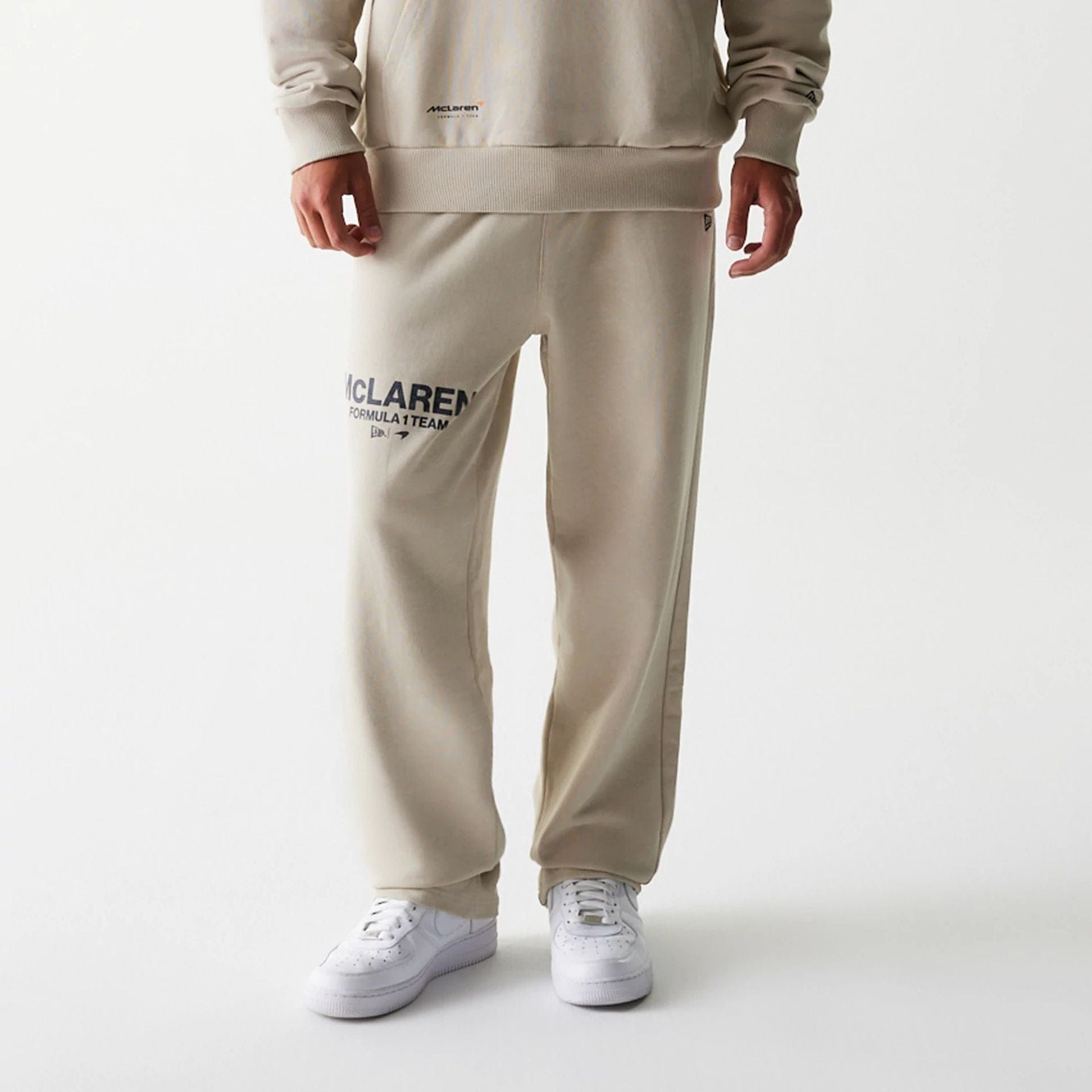 The Male model is wearing McLaren Racing Light Beige Straight Leg Joggers 7