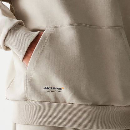 The Male model is wearing McLaren Racing Wordmark Light Beige Oversized Pullover Hoodie 5