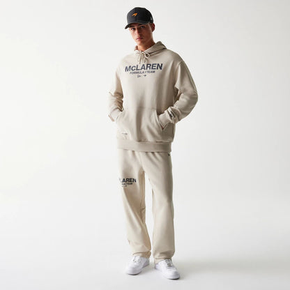 The Male model is wearing McLaren Racing Wordmark Light Beige Oversized Pullover Hoodie 8