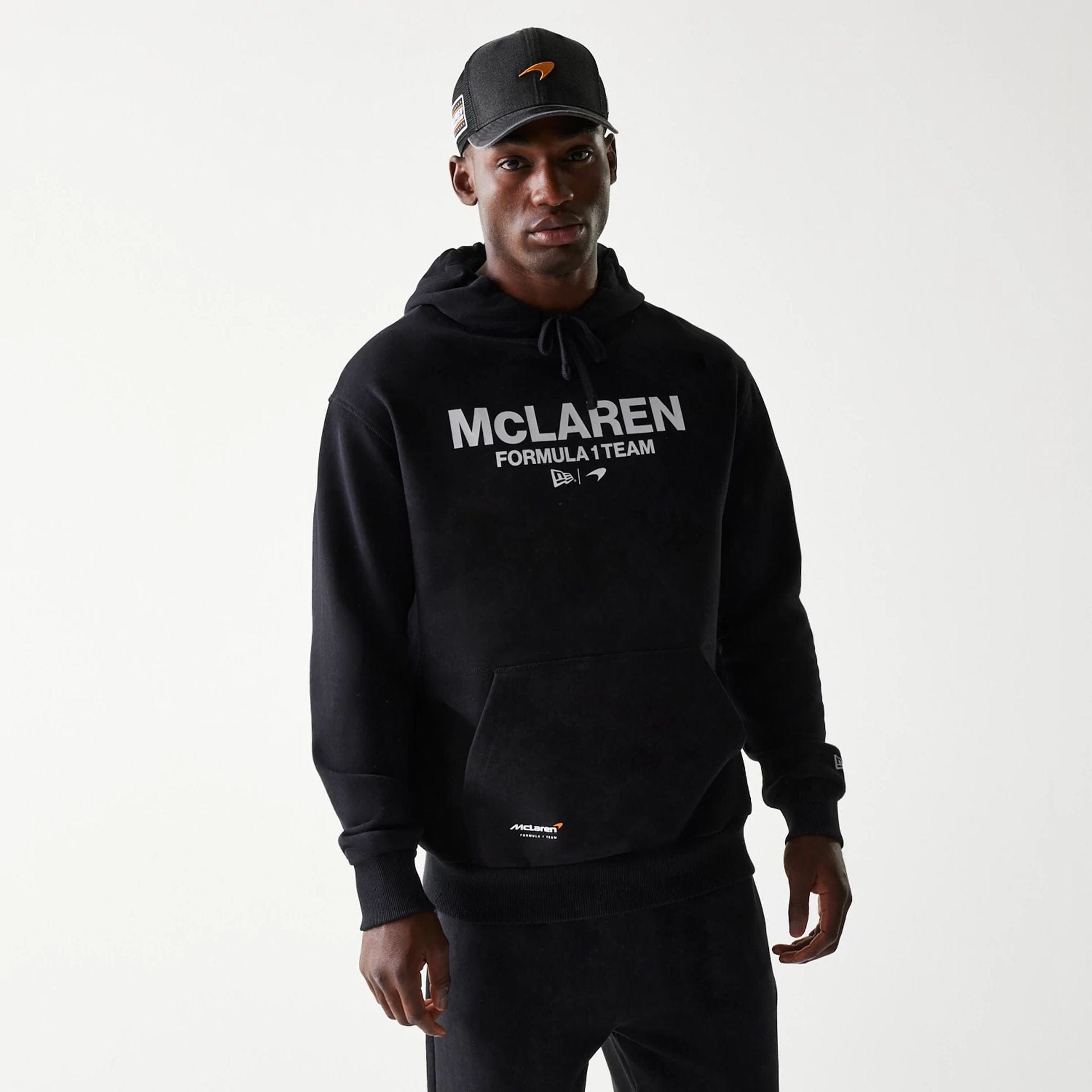 The Male model is wearing McLaren Racing Wordmark Black Oversized Pullover Hoodie 1