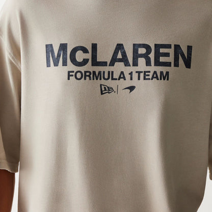 The Male model is wearing McLaren Racing Wordmark Light Beige Oversized T-Shirt 4